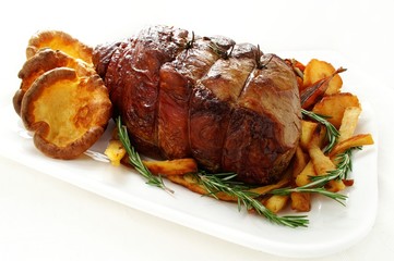 roast joint of beef with vegetables and yorkshire pudding