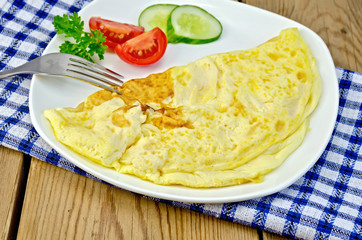 Omelette with vegetables on the board