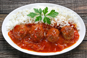 Pork meatballs in tomato sauce with rice
