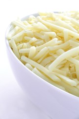 grated cheese in white bowl