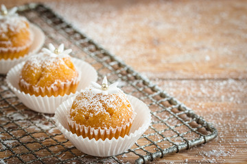 Little cupcakes decorated with sugar flowers