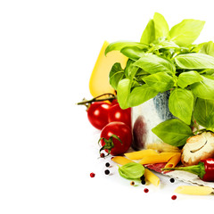 Fresh basil in the pot and italian ingredients