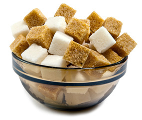 The white refined and brown cane sugar in a bowl