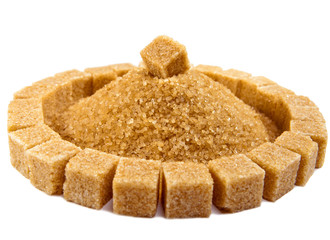 Cubes of sugar lie on circles and heap of granulated sugar 