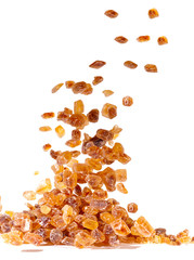Slices of falling brown candy sugar ..