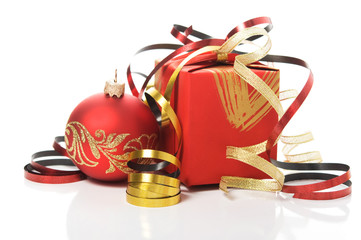 Red gift box with colorful ribbons and xmas baubles