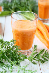 fresh carrot juice in a tall glass