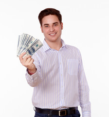 Handsome man holding dollars while smiling
