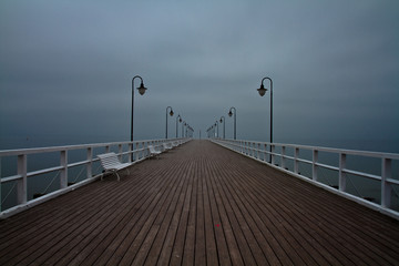 Sunrise on the pier at the seaside, Gdynia Orlowo, Poland. Long 