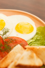fried eggs with vegetables
