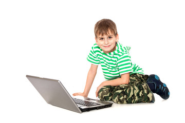 Fototapeta na wymiar Boy holding a laptop