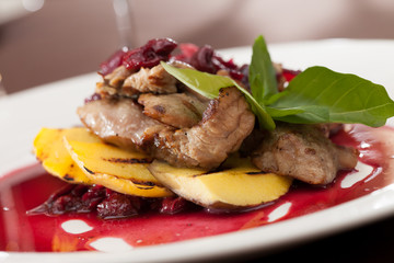 meat with mango and cherry sauce