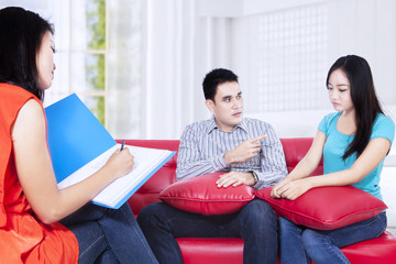 Young couple consultation talking to a psychologist