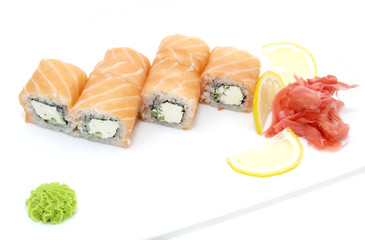 Japanese rolls in a restaurant with fish and vegetables