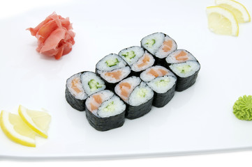 Japanese rolls in a restaurant with fish and vegetables