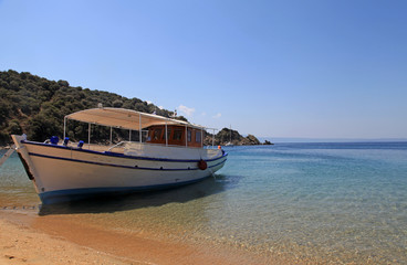 Small traditional ship on a sandy beach, Greece