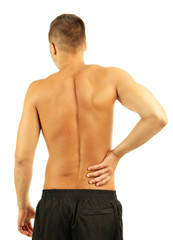 Young man with back pain, isolated on white