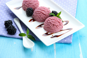 Delicious ice cream on plate on table close-up