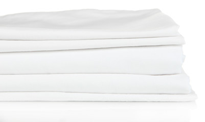 Stack of clean bedding sheets isolated on white