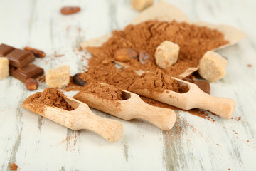 Cocoa powder on wooden table