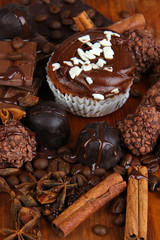 Tasty cupcake with different sweets close up