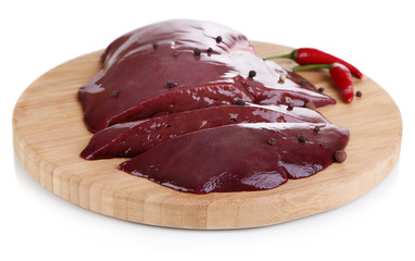 Raw liver on wooden board isolated on white