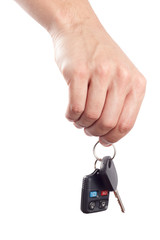 Male hand holds a car key and an alarm control