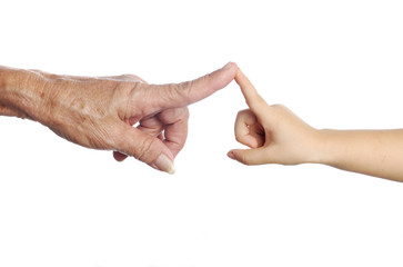 Senior's hand touching a child's hand