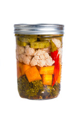 Mixed pickled vegetables in mason jars