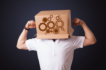 Young man gesturing with a cardboard box on his head with spur w