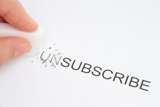 Hand erase part of the unsubscribe word close-up.