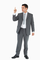 Businessman pointing up