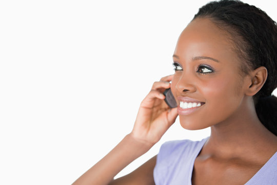 Close Up Of Woman Talking On Her Phone On White Background