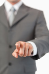 Fototapeta premium Close up of masculine finger pressing a invisible touchscreen