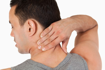 Fototapeta premium Young male massaging his back