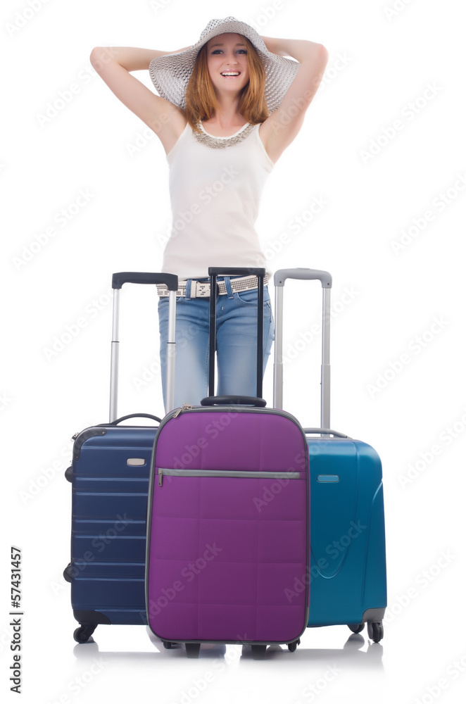 Wall mural girl with suitcases isolated on white