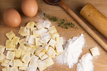 Italian pasta, ravioli with flour eggs and greens