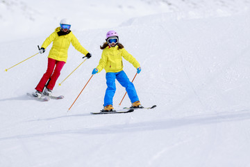 Fototapeta na wymiar Skiing - child skiing downhill, ski lesson