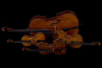 Two Violins, Viola and Cello isolated on black