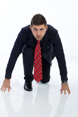 Businessman in a starting position, isolated on a white