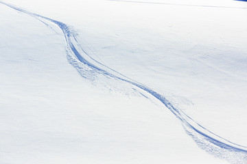 Ski background - freeride tracks on powder snow