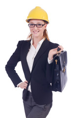 Young businesswoman with hard hat on white
