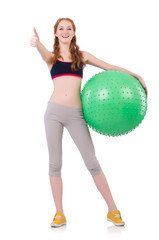Woman exercising with swiss ball on white