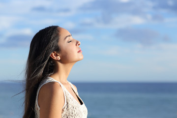 Profile of a beautiful arab woman breathing fresh air