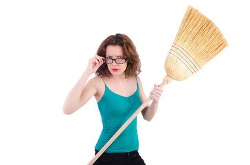 Young woman with broom on white