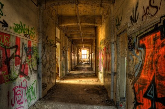 Abandoned corridor with graffiti