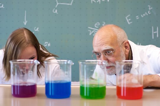 Teacher and stundent analyze chemicals