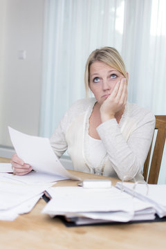 Woman with debts worrying