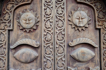 Carved wooden details on a Nepalese temple door