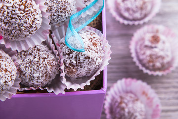 Sweet chocolate balls on wood